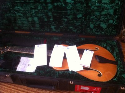 's guitar case opened by airline security.jpg